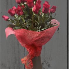 Red roses in recycled vase 