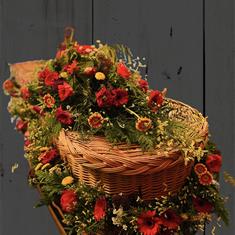 Red and orange casket and garland 